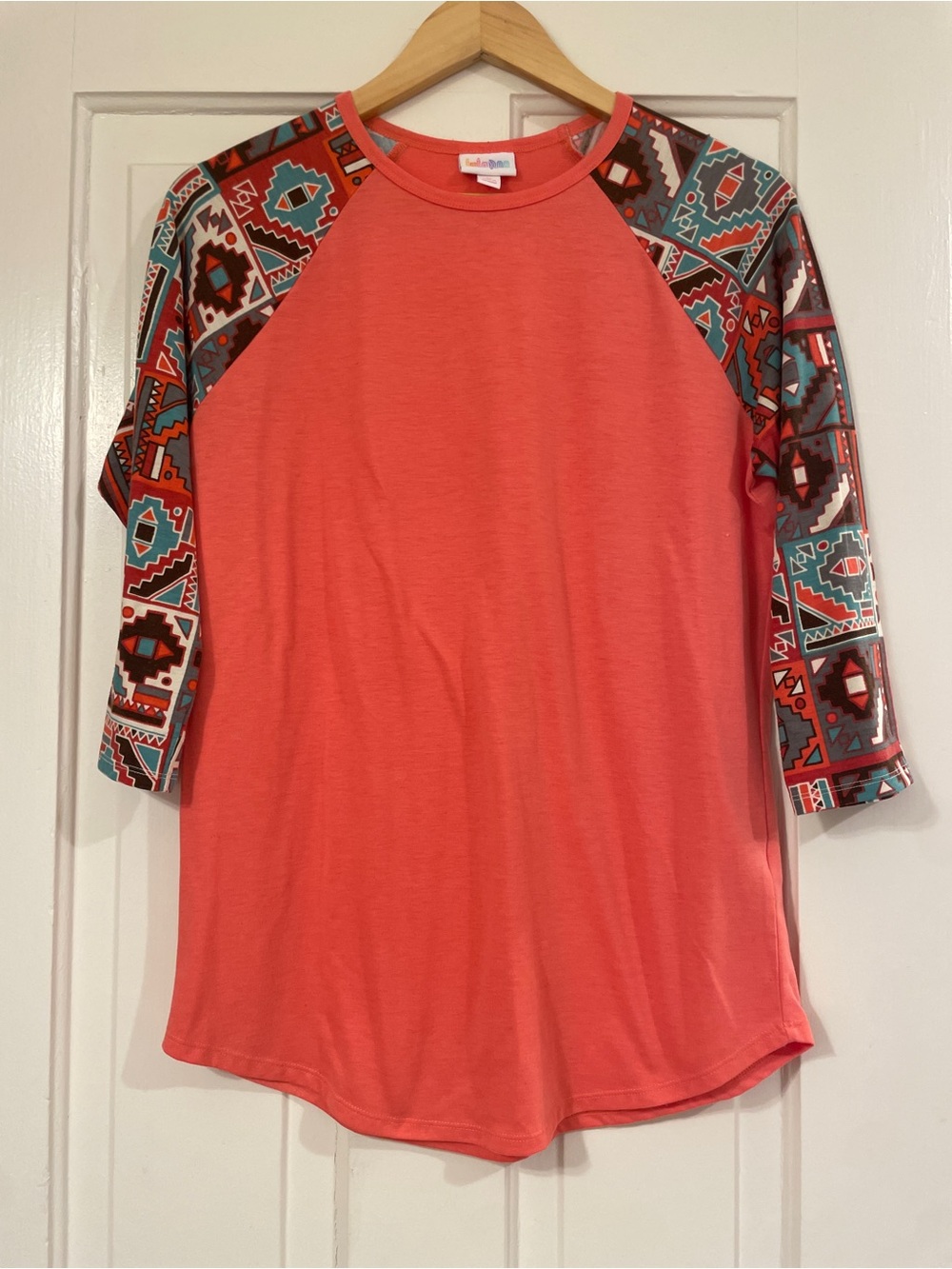 LuLaRoe Coral Raglan Top with Aztec Print Sleeves